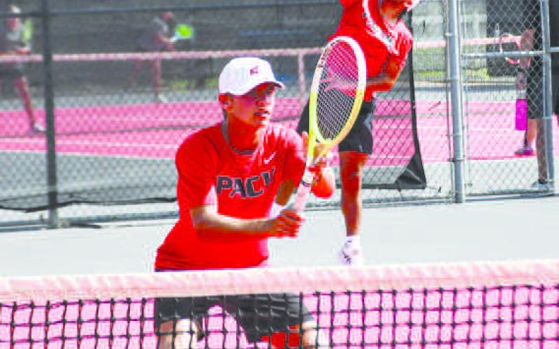 DOUBLE THE INTENSITY – Nathan Ellis gets in position for the set while William Canon serves it in a double’s matchup against Big Spring at the Levelland Tennis Courts on August 2. Ellis and Canon would end up going undefeated in their matches on the day. (Staff photo by Jentezen Smith)