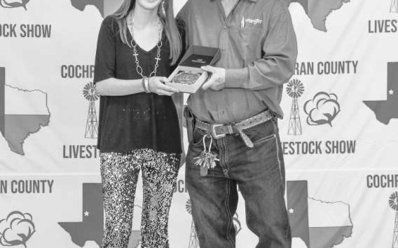 SENIOR RESERVE GOAT SHOWMAN- Cora Sutton received a buckle donated and presented by Billy and Sandy Roberts for winning the Senior Reserve Goat Showman at the Cochran County Livestock Show and Sale. (Staff Photo By Essence Childers)