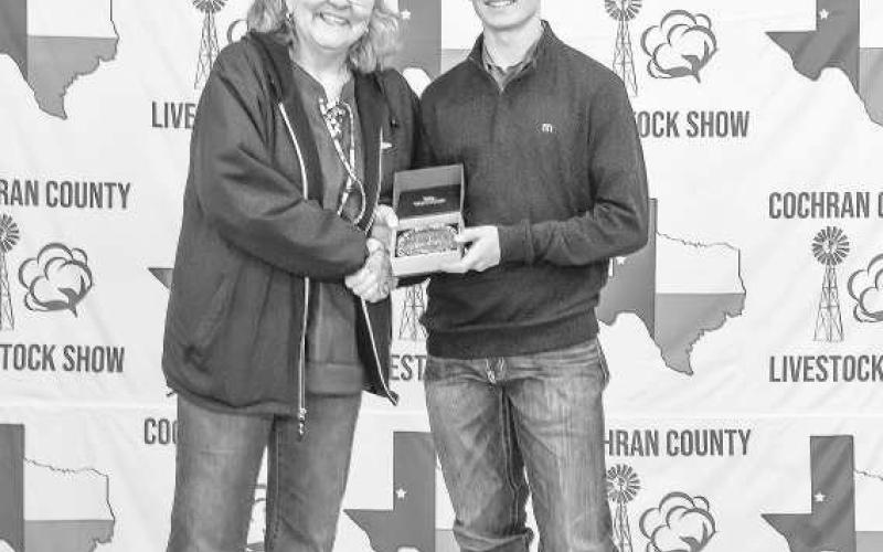 RESERVEGRANDCHAMPIONBARROW- Luke Gresham received a buckle donated and presented by Vicki and Michael Rice for winning the Grand Champion Barrow at the Cochran County Livestock Show and Sale. (Staff Photo By Essence Childers)