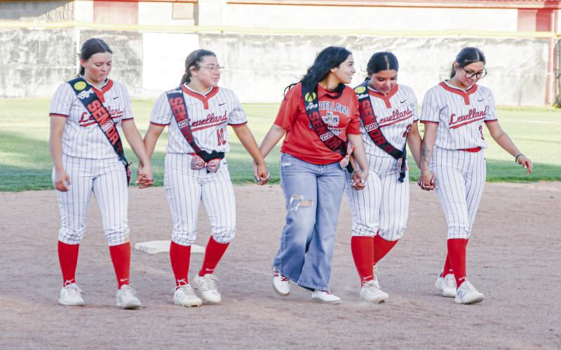 WALK THE BASES - Levelland Loboettes seniors walk the bases at their home field for the final time. Pictured in no particular order is Jazlyn Diaz, Tiffany File, Delaney Delgado, Destinee Olivas and Alexa Luera. (Staff photo by Jentezen Smith)