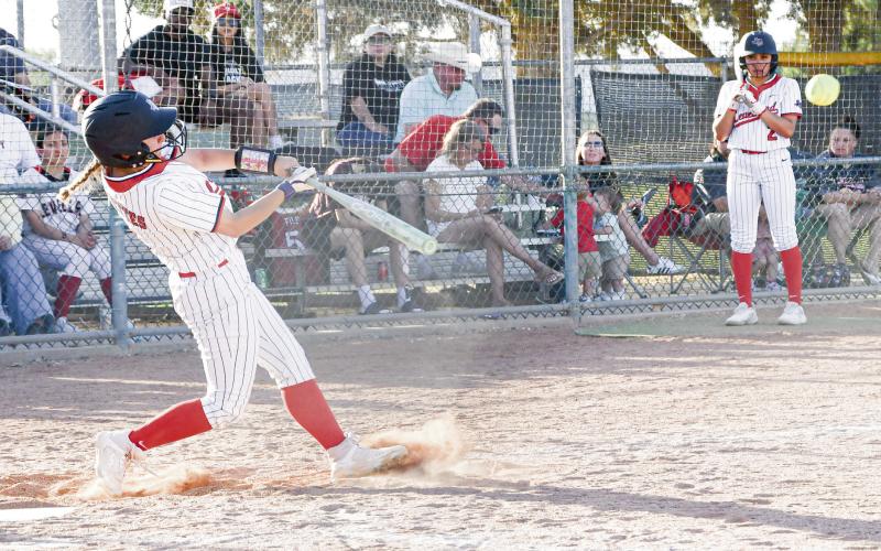 SENT INTO ORBIT - Levelland Loboette Jocelynn Arriaga gets into a pitch and sends it into orbit during their district softball game against Estacado this past Friday night at Levelland High School. Arriaga would go ½ with an RBI and a double in the win. (Staff photo by Jentezen Smith)
