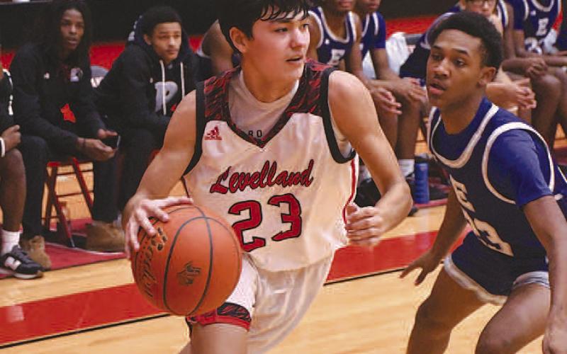 SLIP PAST- Levelland senior guard score three points in 58-52 home win over Estacado last Friday. (Staff Photo by Dom Puente)