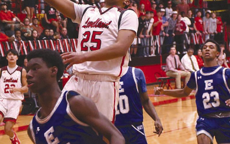 TWO POINTS- Levelland Lobos found themselves back in the win column after a competitive home stand against the Estacado Matadors, 58-52, last Friday. Jayden Castillo put in a lay-up against the Matadors. Staff Photo by Dom Puente)