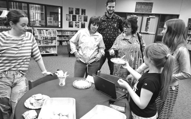 GT STUDENTS - At LMS, Mrs. Shayla Bruce challenged her GT entrepreneurs to think up their own business, create their marketing, and build a website featuring their businesses. LMS Gifted and Talented Students presented their projects to parents earlier this week to show off what they had learned. Pictured is Abigail Gilley ,Estes King with Danielle , Matt Willey and LeeAnn Paxton. (Photo courtesy of Cristal Isaacks)