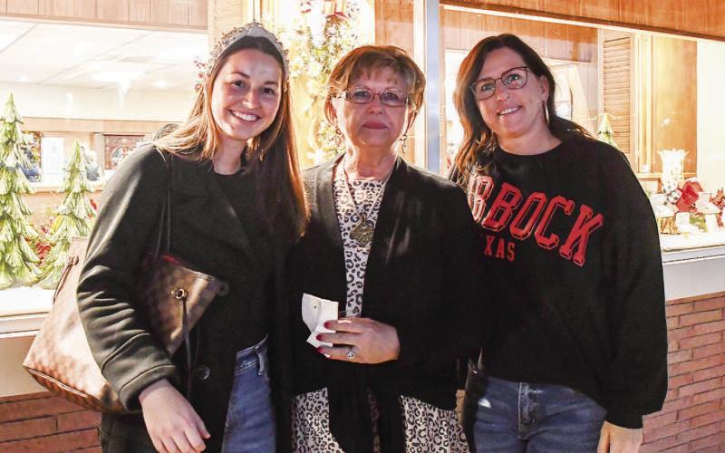 ATCHINSON’S – Cassidy Piaskowski, Donna Brooks and Charlene Winters smiled outside of Atchison’s Jewelry during Thursday nights Ladies Night Out in downtown Levelland. (Staff photo by Evin Thomas)