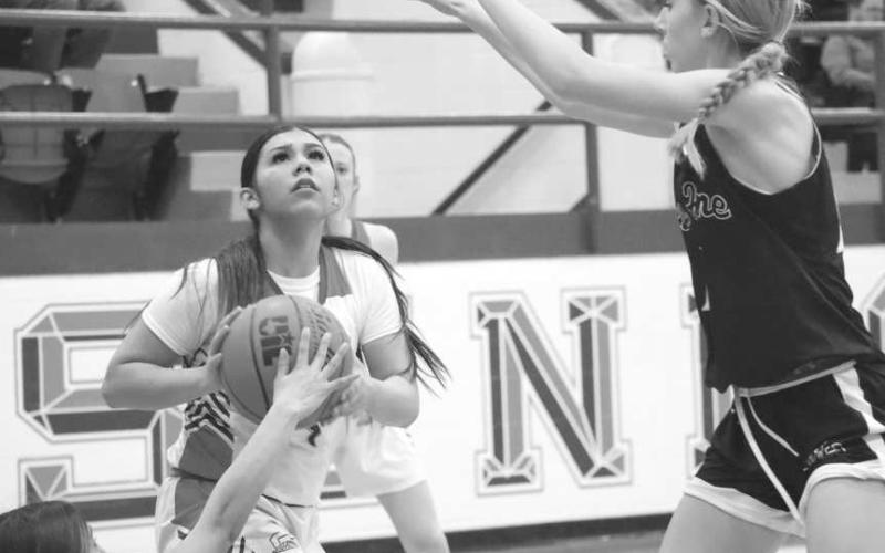 CONTESTED SHOT - Sundown Roughette Yaya Lopez concentrated on the shot during the teams contest last Tuesday against the New Home Lady Leopards at home. (Staff photo by Aalijah Soliz)