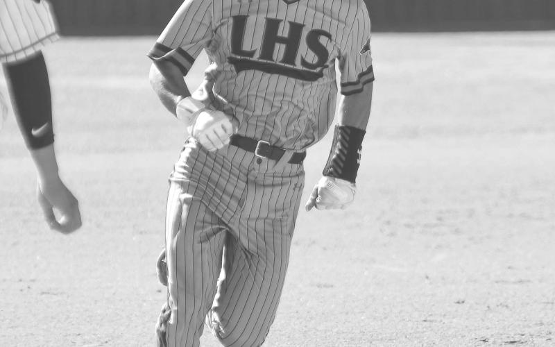FULL SPEED - Levelland Lobo Noah Tienda ran full speed during the teams Linedrive Classic Tournament last week. The Lobos will face-off against Denver City Monday as the home team at 12 p.m. (Staff photo by Dom Puente)