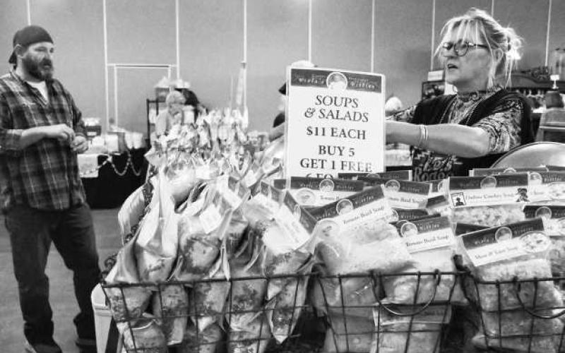 Michelle Kizzek was seen doing her booth for her company Violas Vittles at the Petticoats on the Prairie event held on Friday and Saturday at the Mallet Event and Arena. (Staff photo by Hannah Woodrum)