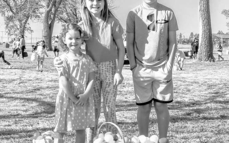 HUNTING FOR EGGS - The City of Levelland’s’ Parks Department hosted their annual Easter Egg Hunt this past Saturday at the City Park near Pavillion One. Pictured from left to right are: Brinleigh Durham, Jacelyn Madewell and Jarrett Madewell. (Staff photo by Hannah Woodrum)