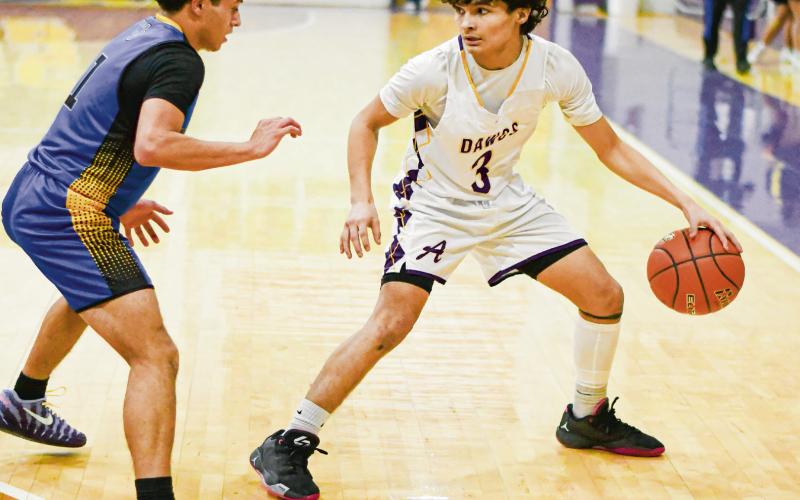 CAMPOS ON THE DRIBBLE - Anton Bulldog Shooter Campos dribbles the basketball during a game against Wellman Union this past Friday night at Anton High School. (Staff photo by Jentezen Smith)