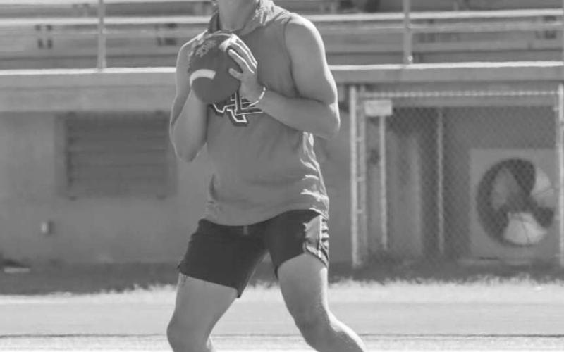 FIELD VISION - Levelland Lobo Boston Winfield was making his reads during the team’s 7 on 7 games against Estacado and Coronado in Lubbock this Monday. Winfield has continued to build off of his substantial playing time last season at the quarterback postion. Heading into this season, Winfield will be looking to establish himself as the starting quarterback once two-a-days begin in August. (Staff photo by Aalijah Soliz)