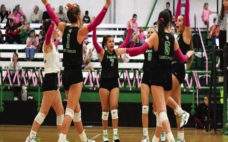 TIME TO CELEBRATE - The Ropes Lady Eagles varsity volleyball team celebrates together after scoring a point during their match against Olton this past Tuesday. The Lady Eagles would go on to win 3-1. (Staff photo by Jentezen Smith)