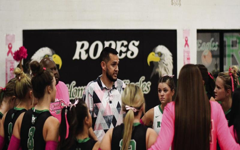 COACH ‘EM UP - Ropes Volleyball Head Coach Jon Montanez instructs his athletes in a timeout during their match against Olton this past Tuesday. Montanez would lead the Lady Eagles to a 3-1 win. (Staff photo by Jentezen Smith)