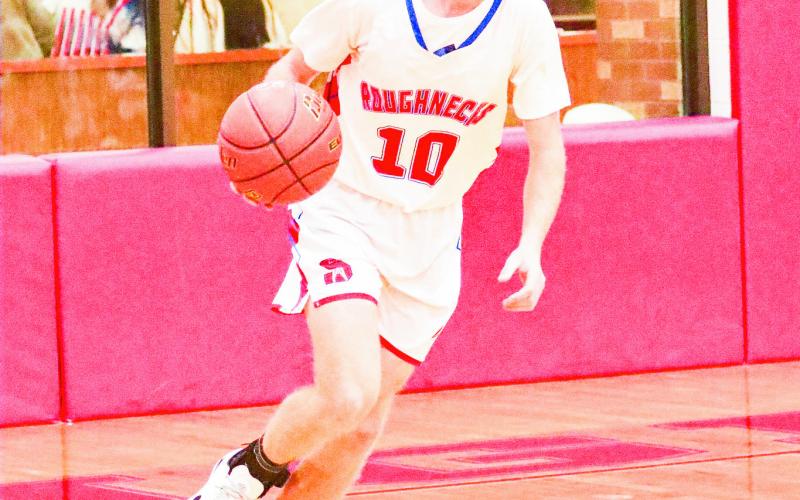 IGO BRINGS IT UP - Sundown Roughneck Isaiah Igo dribbles the basketball up the court during a home game earlier this month. Igo scored five points in the win against Sudan. (Photo provided by Sundown ISD)