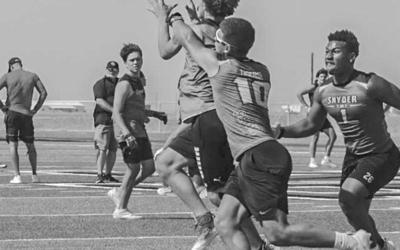 CONTESTED CATCH - Ropes Eagle Malikai Mendez made the tough catch in traffic during the team’s 7 on 7 game in New Home against the Snyder Tigers this past Monday. (Staff photo by Aalijah Soliz)