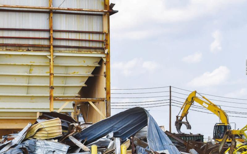 DEMOLITION - Demolition of delapidated structures has been ongoing at ADM Southern Cotton Oil. Multiple structures on the property were destroyed following the devastating storm on May 29. (Photo courtesy of Emily Campos)
