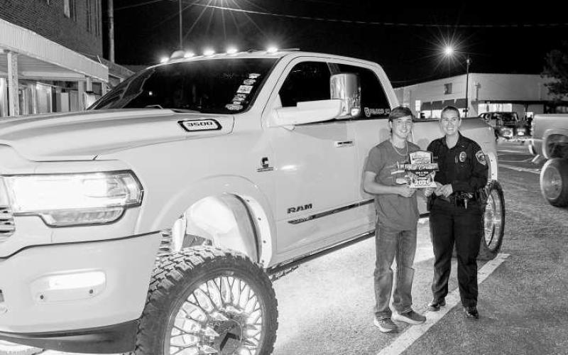 CRUISE WINNER - Pictured is Caden Crenshaw with LPD Chief Erica O’Bryon after receiving an award during the Thunder on the Plains Cruise. (Photo courtesy of J. Conrad Photography)