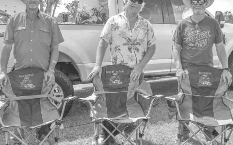 CHAIR AWARDS – The Thunder On the Plains Committee awarded three winners with lawn chairs at the Thunder On the Plains Car Show on Saturday at the Levelland City Park. Tye Taylor won a chair for Best Chevy, Bill Varner won Best of the Rest and Best MOPAR went to Rocky Sheppard. (Staff photo by Ada Niederhauser)