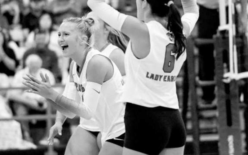 SCORE! – Lily Greer and Allye Bandy celebrate scoring a point for Ropes during the volleyball match against Sterling City on August 12 during their season opener at home. (Staff photo by Jentezen Smith)