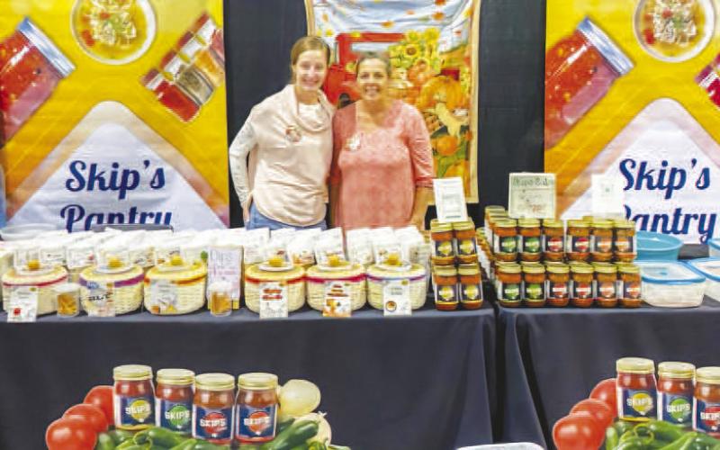 SKIP’S SALSA - Petticoats on the Prairie has become an anticipated event for surrounding community members as the vintage market draws numerous vendors. The event was held at the Mallet Event Center and Arena this past Friday and Saturday. Skip’s Salsa was a vendor at the event and pictured is Tami Potts and Angela Montiel. (Staff photo by Myra Guerrero)