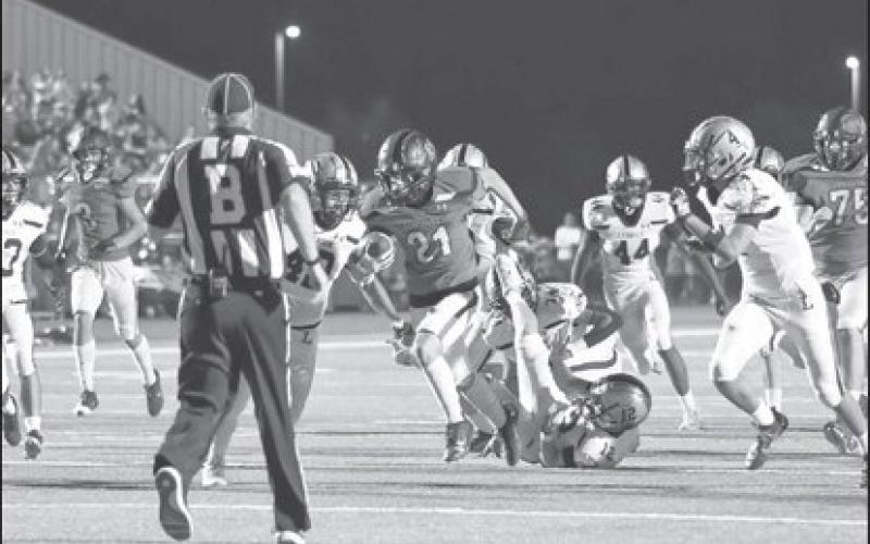 OPEN FIELD - Levelland running back Jake Potter broke through the offensive line up the middle for the good gainage of yards during their homecoming win. (Staff photo by Dom Puente)