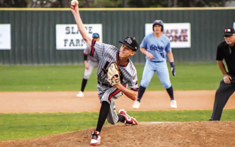 RELIEF EFFORT - Lobo Kane Rice pitched five and a third innings in relief during Tuesday’s district game at home against the Liberty Patriots. In the outing, Rice would allow two runs on five hits and three walks. The pitcher would also record two strikeouts. The Lobos would drop the district home game, 11-10. (Staff photo by Dom Puente)