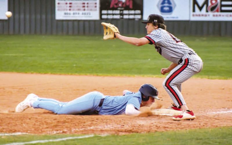 KEEPINGHIM CLOSE - Lobo first baseman Gage Potter kept the Liberty baserunner close during Tuesday’s district game at home against the Liberty Patriots. The Lobos would battle the Patriots into extra innings before falling, 11-10. (Staff photo by Dom Puente)