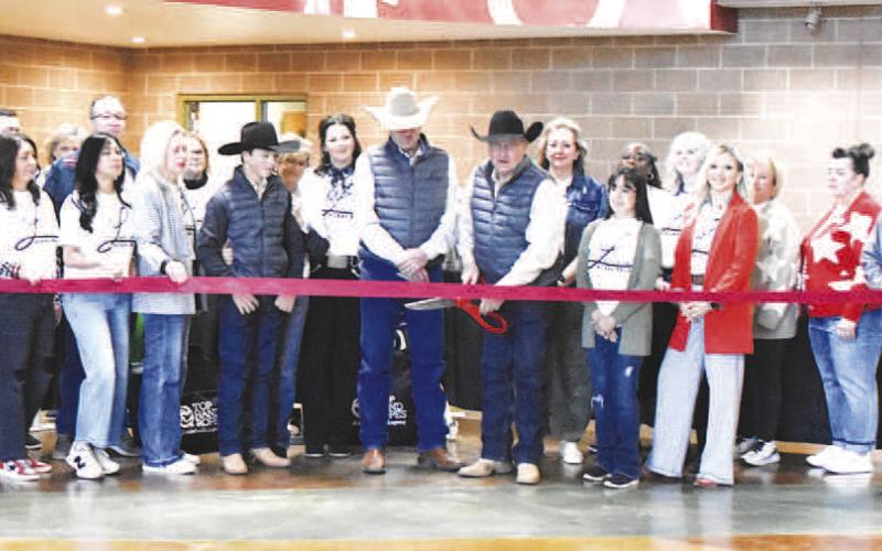 LEVELLAND HORSE SALE RIBBON CUTTING-- The Levelland Horse Sale celebrated it official rebranding with a ribbon cutting this past Friday to kick off the horse and stockdog sale. Owner Steve Friskup, Charlie Rogers and their families were joined by the Chamber of Commerce, city and county officials, as well as State Rep. Ken King to usher in the business which will be a boon to Levelland. (Staff photo)