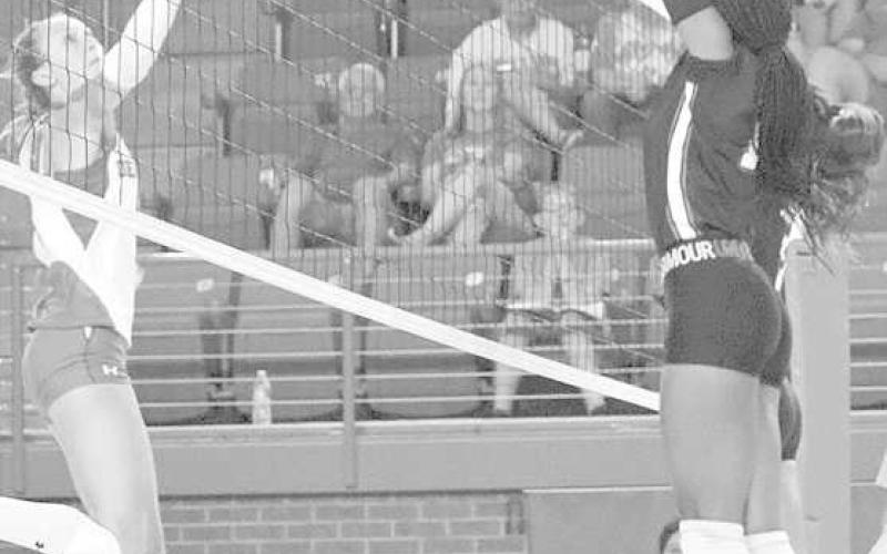 BLOCK - Levelland athlete Tanaeasia Brackens went up to block the Denver City athlete during their first scrimmage of the season. (Staff photo by Aalijah Soliz)