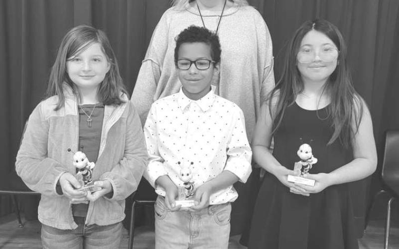 SPELLING BEE-- South Elementary held their annual third-grade Spelling Bee today! The Bee went for 6 Rounds and the winner was Caroline Martin, spelling the word, speck. The Runner-Up was Darion Lucas and the Alternate was Faith Cancino-Chapa. These students will move on to the District Bee next Tuesday at LMS at 1:30, and they will be joined by Capitol, LIS &amp;amp; LMS winners. Shown are, Caroline Martin, Darion Lucas, and Faith Cancino-Shapa with Spelling Bee Chair Robyn Parkinson. (Submitted Photo)