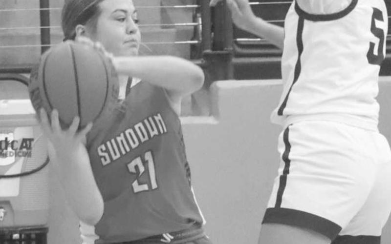 SMART MOVES - Sundown Roughette Kadee Riley passed the ball upcourt to break the Tulia Lady Hornets defense during the teams contest in the Littlefield Tournament. (Staff photo by Aalijah Soliz)