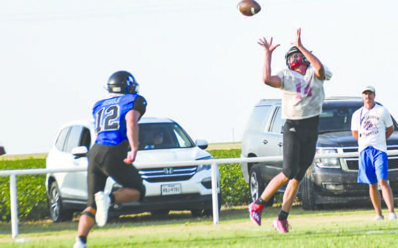 GO LONG – Junior offensive lineman/tight end Hudson Dobrovolny caught a deep ball during a scrimmage last Friday at home against the Lubbock Titans and Nazareth. (Staff photo by Jentezen Smith)