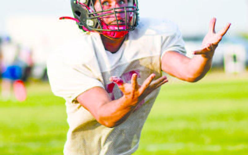 BRING IT IN – Whitharral Panthers junior offensive lineman/tight end Bradley Gray focused on the ball and made the catch during a scrimmage last Friday at home against the Lubbock Titans and Nazareth. (Staff photo by Jentezen Smith)