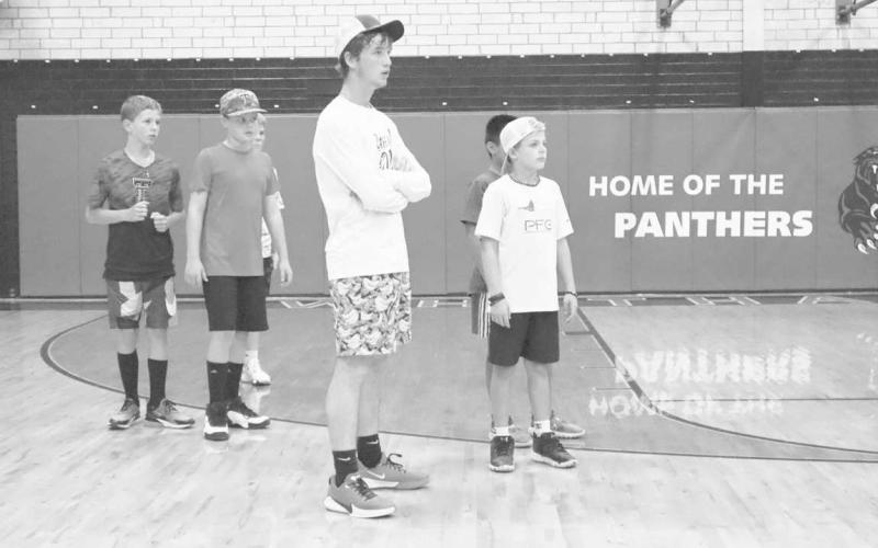 ATTENTION - Whiteharral athlete Rayden Potter and Whitharral student Corbin Edwards were paying attention to the coaches as they were getting ready for more drills. (Staff Photo by Aalijah Soliz)