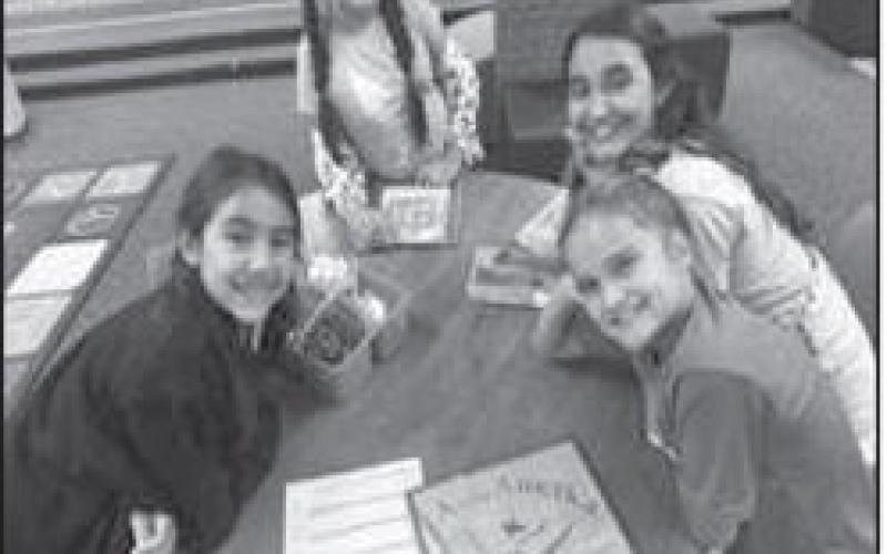 CELEBRATE FREEDOM WEEK-- Capitol Elementary students wrapped up Celebrate Freedom Week last week in the library with Mrs. Alexander. Students read a variety of books, wrote poems, discussed what they value about their freedom, what freedom means to them, watched a podcast of a book about our Founding Fathers, and learned a song and poem about the Preamble to the Constitution. Pictured are Addisyn Garza, Jamisyn Garza, Makenzie Del Campo, Samantha Villalba (Levelland ISD photo)