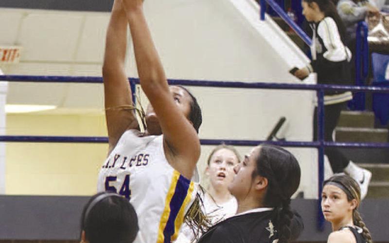 PAINT REBOUND- The Lady Antelopes won the Way Out West Basketball Tournament in Whiteface over the weekend. Tymmyah Olenga pulled down a rebound in the paint. (Photo Courtesy of Holly Crutcher)