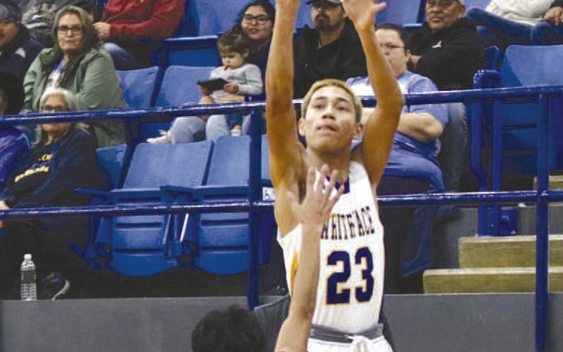 IN YOUR FACE- The Antelopes won the Way Out West Basketball Tournament in Whiteface over the weekend. Jeremiah Rendon shot a jumper in the face of a defender. (Photo Courtesy of Holly Crutcher)