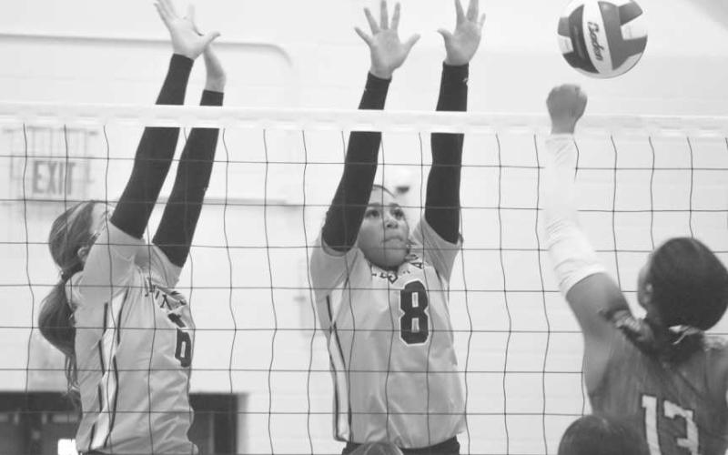 VERTICAL - Levelland Loboettes Hailiee Estrada and Mia Sepulbeda went up to block the Lake View Maidens shot last Tuesday night on the road during district play. (Staff photo by Aalijah Soliz)