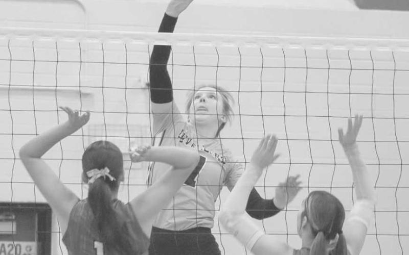 TRICKED - Levelland Loboette Addisen Campbell hit the ball to the side during her team’s contest against Lake View to mess the defense up during district play. (Staff photo by Aalijah Soliz)