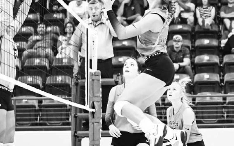 TAKE FLIGHT – Lila Forsythe takes flight as she goes up for the spike on the pass from her teammate Allye Bandy during a volleyball game against Vega this past Tuesday. That would be game one of a doubleheader in Littlefield, where they also played Littlefield. They won both matchups, 2-1 and 3-0. (Staff Photo by Jentezen Smith)