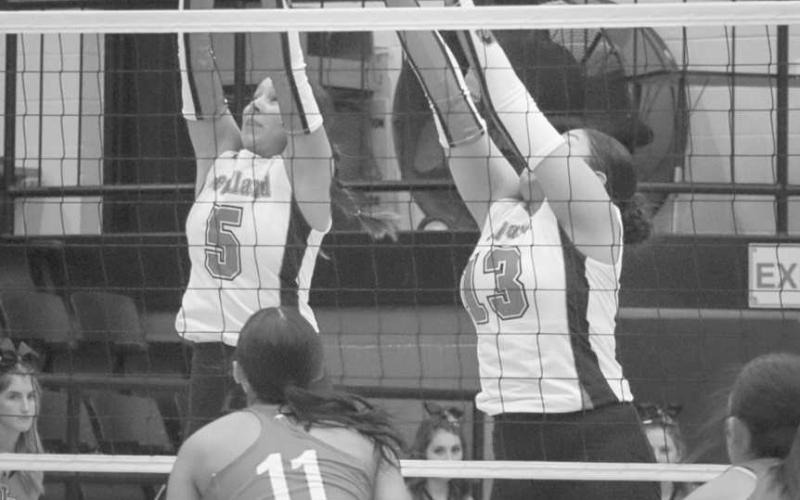 BLOCKED - Levelland Loboettes Allison Monge and Diana Roman blocked the spike from the Denver City Lady Mustang this past Tuesday during their season opener. (Staff photo by Aalijah Soliz)