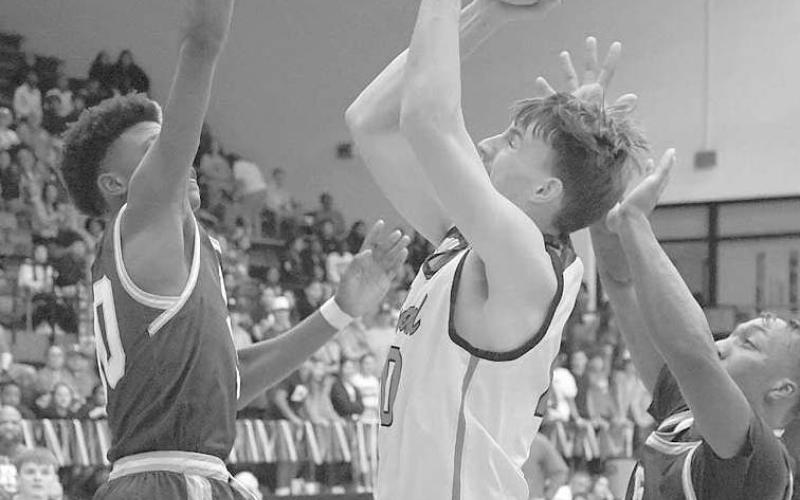 OFFENSIVE PUT BACK-Lobo Konner Alexander put back an offensive board against Estacado. Levelland won a competitive home game against the Matadors, 58-52, Friday night. The Lobos will travel to Big Springs Friday. (Staff Photo by Dom Puente)