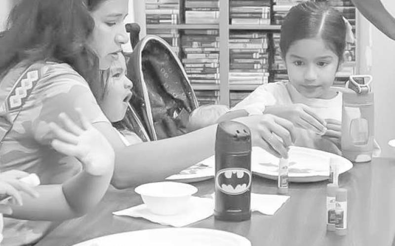 FAMILY FUN - Families were having fun with each other at the summer reading program at the Hockley County Library “Doodles and Donuts”. (Staff Photo by Aalijah Soliz)