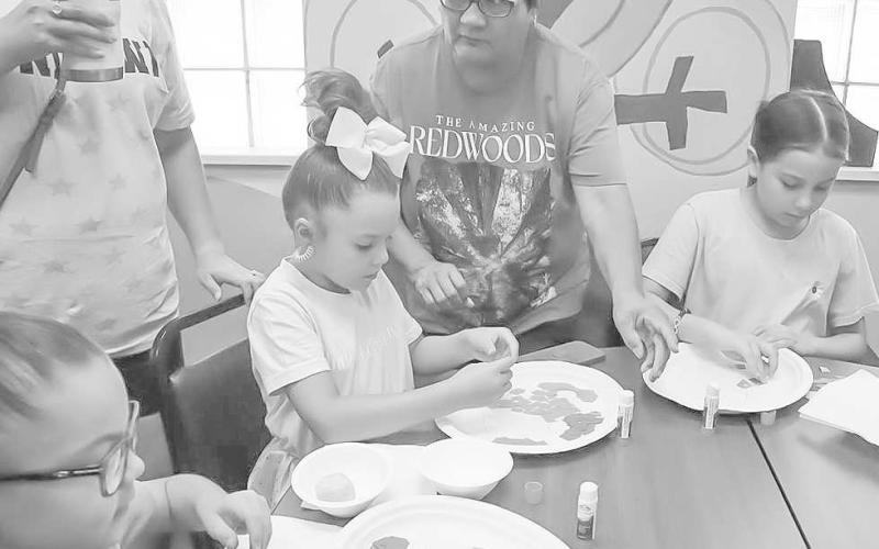 CREATIVITY - Mothers were helping their kids with projects at the Hockley County Library summer reading event ‘Doodles and Donuts ‘ this past week. (Staff Photo by Aalijah Soliz)