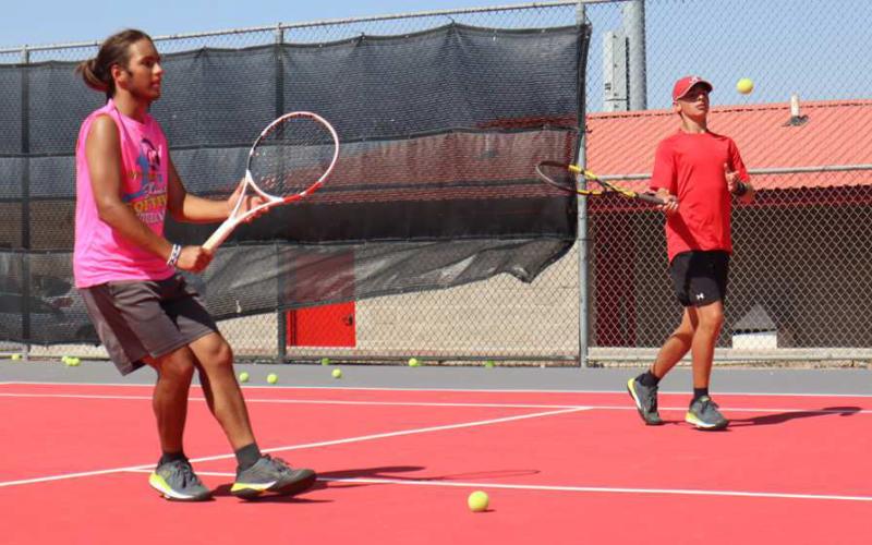 DOUBLES - Levelland athletes Michael Canon and Nathan Ellis were practicing at Levelland Tennis twoa- days. (Staff Photo by Aalijah Soliz)