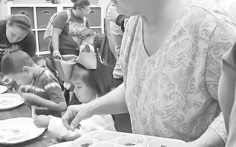 VOLUNTEER -The Hockley County Library hosted “Doodles and Donuts” this past week for the summer reading program. Many volunteers have showed up to help throught the summer. (Staff Photo by Aalijah Soliz)