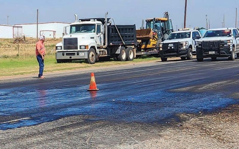 Crews from TxDOT and local contractors worked an oil spill cleanup that was caused when a transformer fell off a transport truck, Tuesday, at the intersection of Highway 114 and FM 1780 in Whiteface. The Whiteface Fire Department and Cochran County Constable provided traffic control before TxDOT units arrived. (Photo courtesy of Jay Kelley)