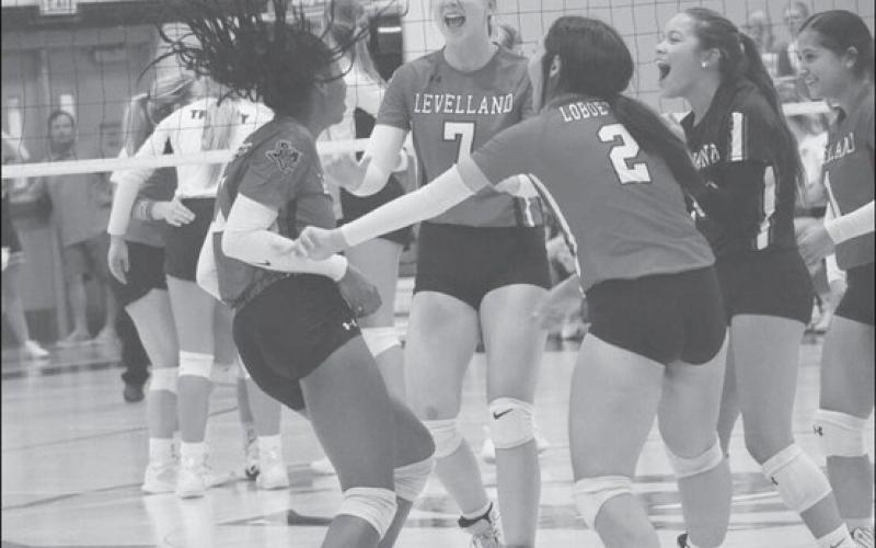HYPED - Levelland Loboettes were excited as the swarmed Tanaesia Brackens for the great point she earned for the team. The Loboettes started district play this past Saturday as the away team against a decent Sweetwater team. (Staff photo by Aalijah Soliz)