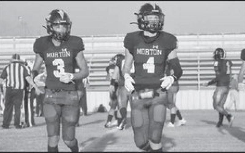 DUO - Morton athletes AJ Mendoza and Lane Lyon were getting the playcall from the coaches on the sideline during the teams homecoming game last Friday. (Staff photo by Aalijah Soliz)