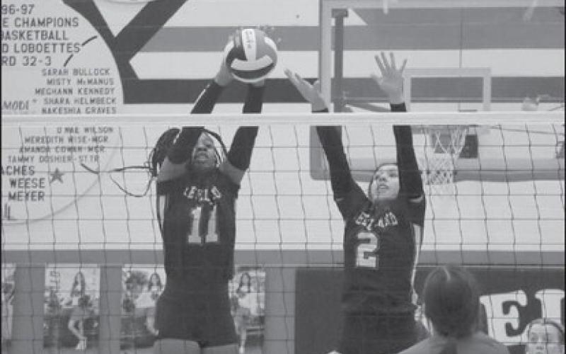 EFFORT - Taylyn Ledesma and Tanaesia Brackens went up to block a shot that the Cubs had sent their way this past Tuesday during the teams competition. The Loboettes had played their next game of the season against Lamesa as the away team this past Saturday. (Staff photo by Aalijah Soliz)